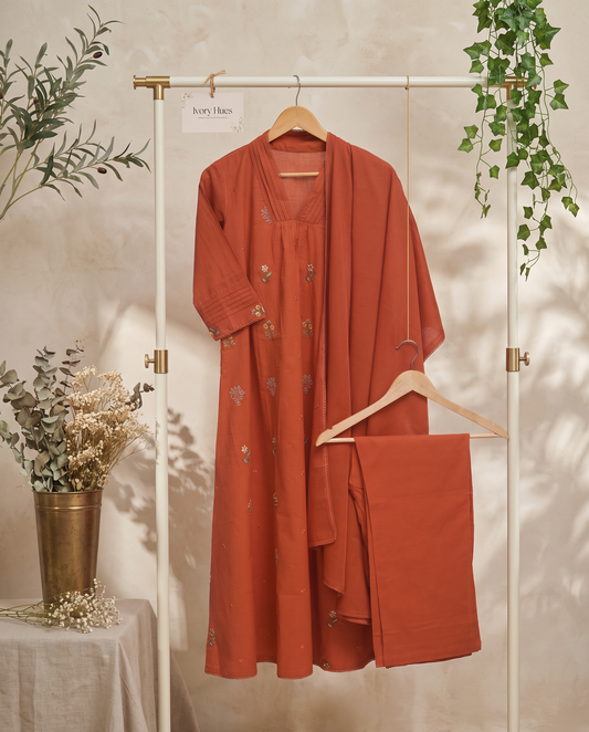 Anokhi Vasundhara — three-piece rust cotton suit with embroidery and lace detailing — Ivory Hues, Indian ethnic wear Singapore
