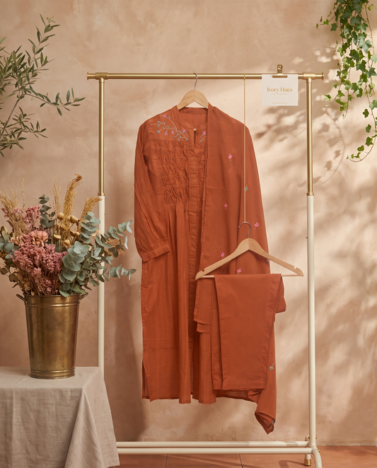 Anokhi Dhara — rust suit set with smocking, beadwork and embroidery — Ivory Hues, Indian ethnic wear Singapore
