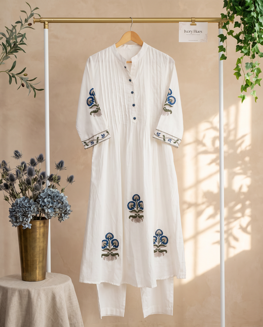 Meher Sitara — white cotton co-ord set with pintuck pleats and flower-shaped buttons — Ivory Hues, Indian ethnic wear Singapore