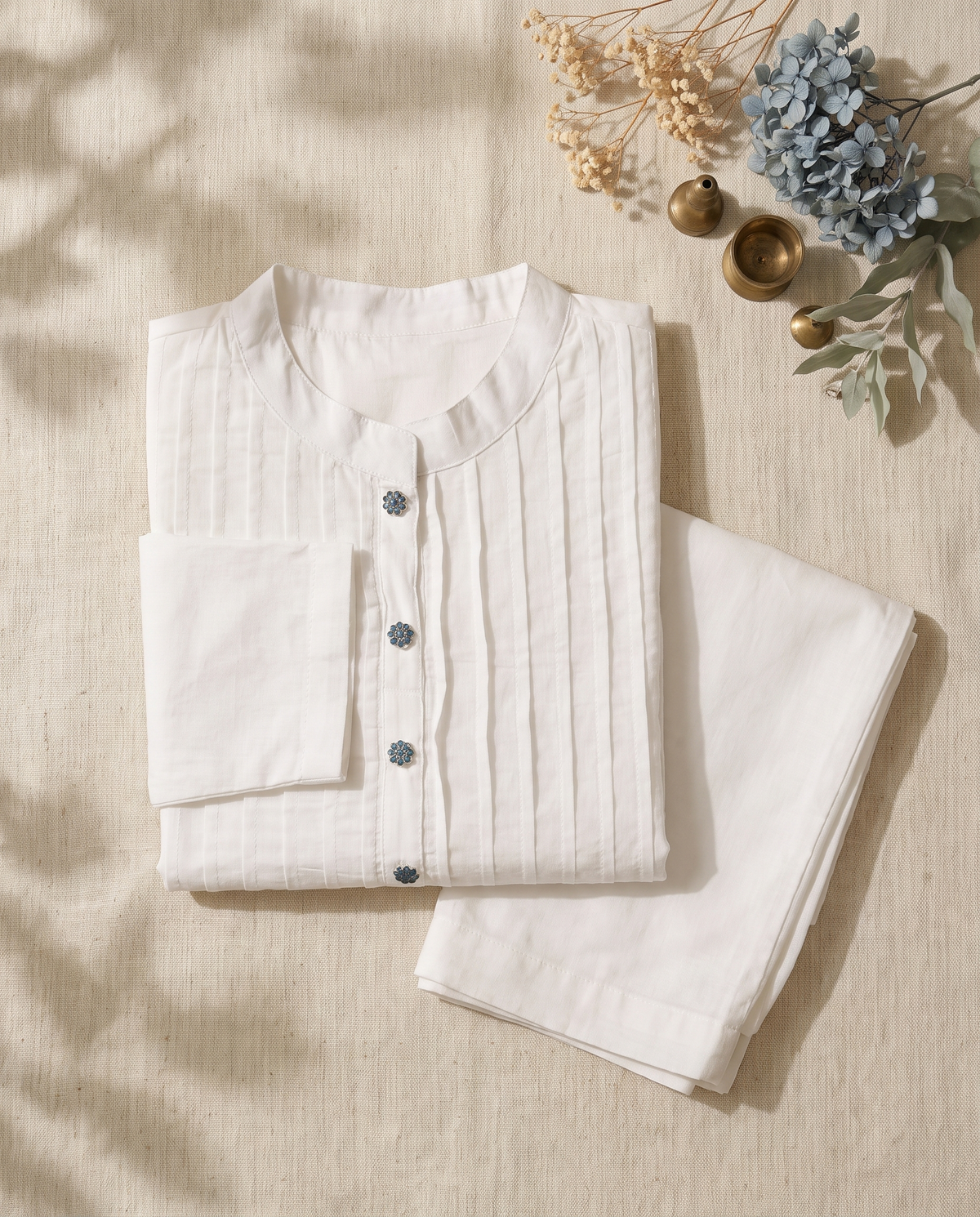 Meher Sitara — white cotton co-ord set with pintuck pleats and flower-shaped buttons — Ivory Hues, Indian ethnic wear Singapore