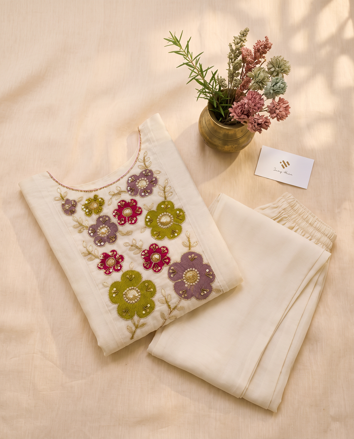Noor Aria — off-white mul Chanderi suit with colorful floral embroidery — Ivory Hues, Indian ethnic wear Singapore