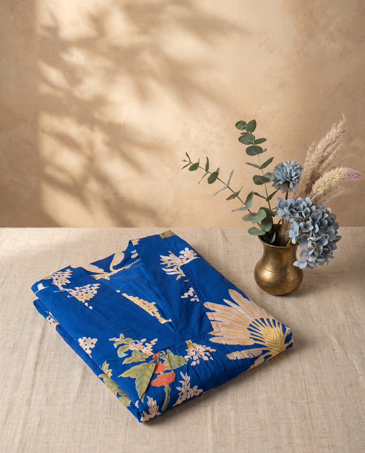 Fiza 3.0 Tropical Blue — blue poppy-print cotton dress with V-neckline and pockets — Ivory Hues, Indian ethnic wear Singapore