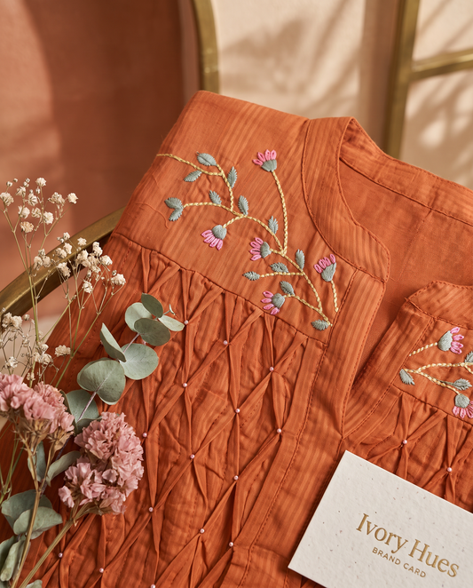 Anokhi Dhara — rust suit set with smocking, beadwork and embroidery — Ivory Hues, Indian ethnic wear Singapore