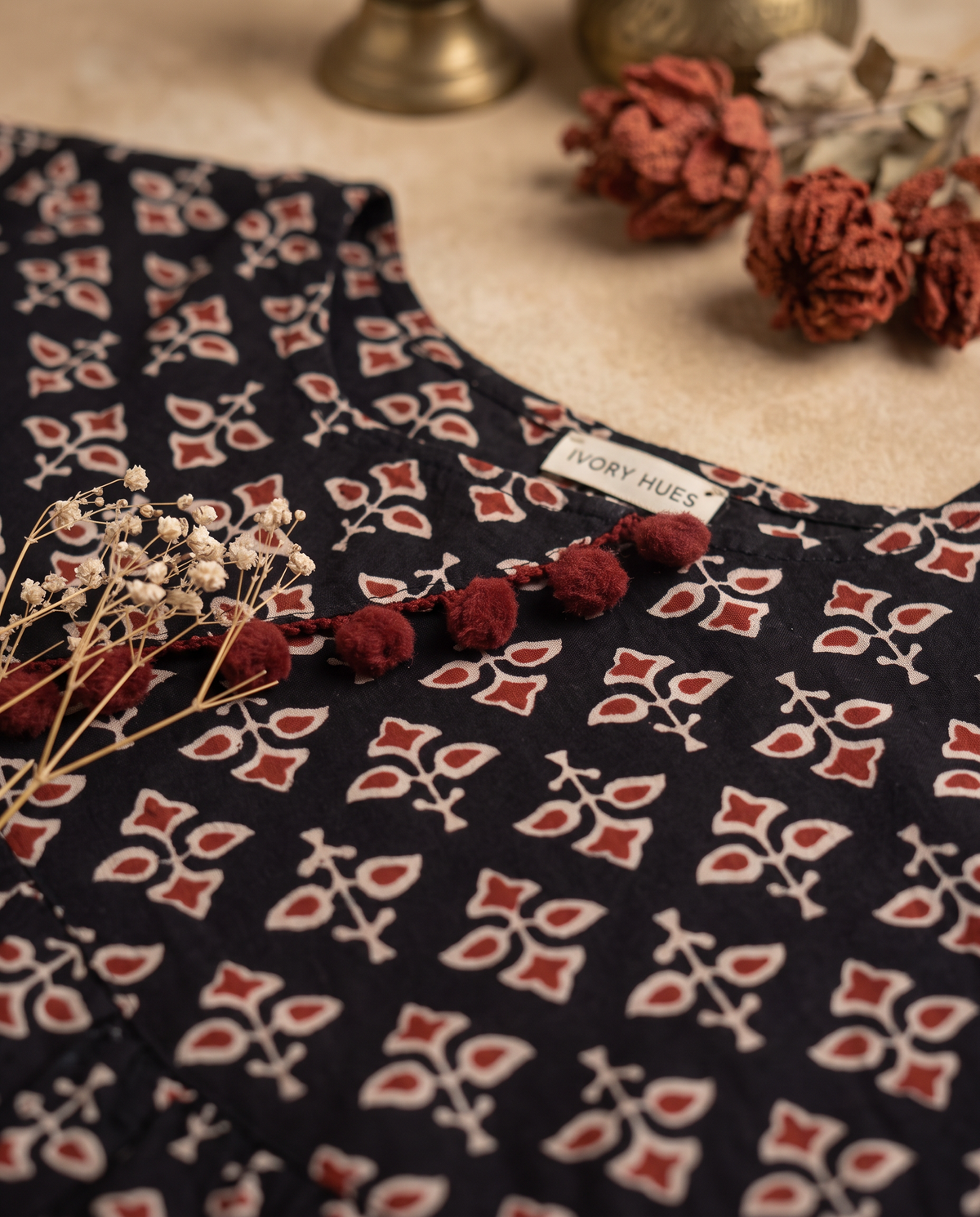 Leher Phool — black dress with rust floral block print and pom-poms — Ivory Hues, Indian ethnic wear Singapore