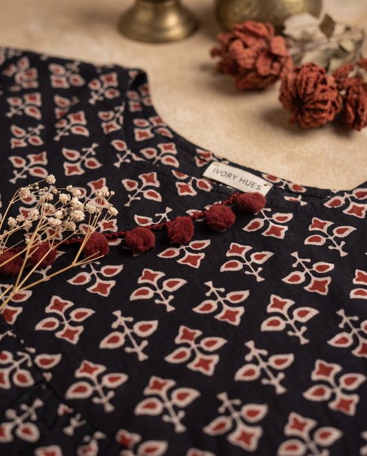 Leher Phool — black dress with rust floral block print and pom-poms — Ivory Hues, Indian ethnic wear Singapore