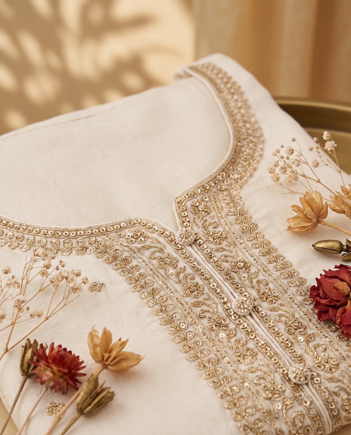 Noor Naira — off-white jacquard silk suit with red-magenta brocade dupatta — Ivory Hues, Indian ethnic wear Singapore
