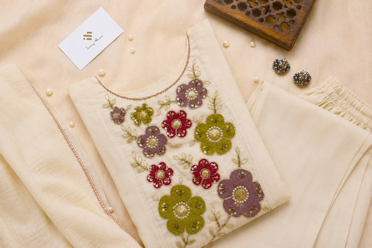 Noor Aria — off-white mul Chanderi suit with colorful floral embroidery — Ivory Hues, Indian ethnic wear Singapore
